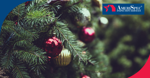 A close-up of a festive Christmas tree branch adorned with red and gold ornaments