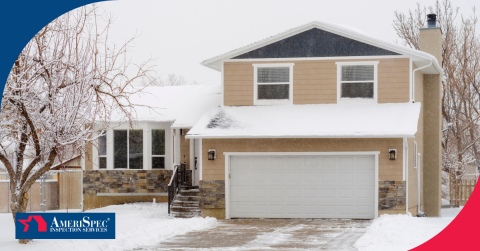 Two-story suburban home covered in snow with a garage and a snow-covered driveway.