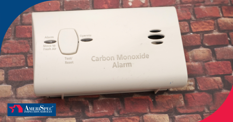 Carbon monoxide alarm placed against a brick background