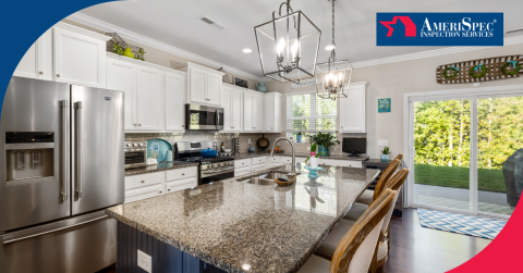 Modern kitchen with white cabinets, granite countertops, and stainless steel appliances.